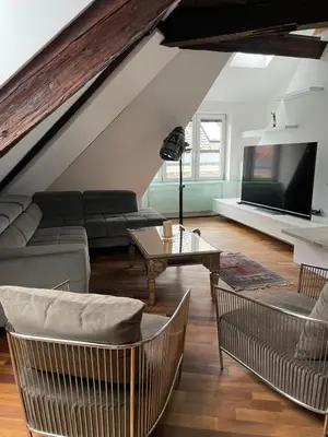 a living room with a couch and a table at AB Ljubljana - Breg Apartments in Ljubljana