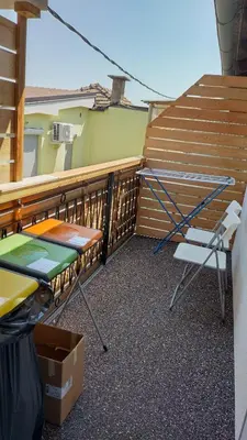 a balcony with a table and chairs and stairs at Apartma VAL - Maribor in Maribor