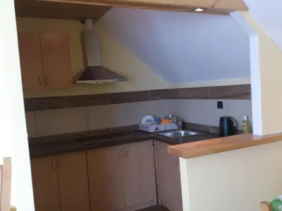 a small kitchen with a sink and a stove at Apartmaji Sparakel in Bled
