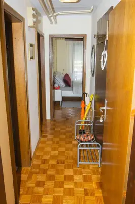 a hallway with a cart in the middle of a room at Apartment Karlie in Rogaška Slatina