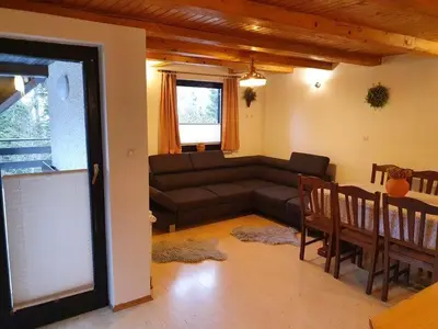 a living room with a couch and a table at Chalet Anita Rogla in Zreče