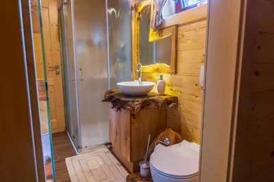 a bathroom with a sink and a toilet at Lake Cottage - Koča ob jezeru in Nazarje