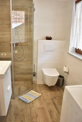 a bathroom with a shower and a toilet at Apartments Old Town in Ljubljana