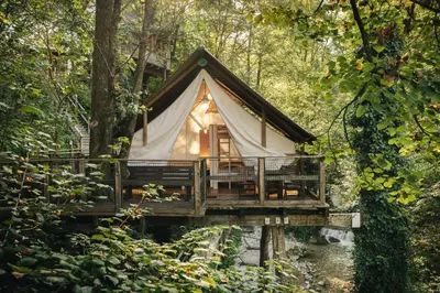 a cabin in the woods on a bridge at Garden Village Bled in Bled