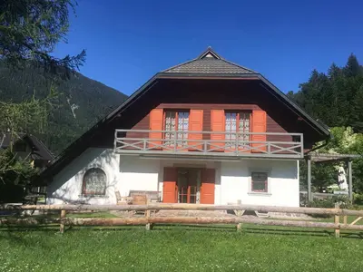 a house with an orange and white at Villa Dona in Kranjska Gora