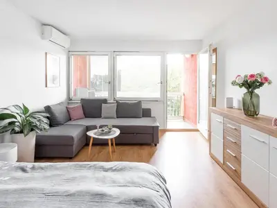 a living room with a couch and a table at Apartma Vrtnica 5th floor in Nova Gorica
