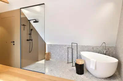 a bathroom with a bath tub and a shower at Hisa 1624 - Adults Only in Zgornja Kungota