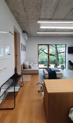 a living room with a couch and a table at HOUSE G in Dekani