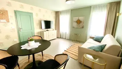 a living room with a couch and a table at Aria Apartments in Kojsko