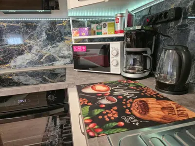 a kitchen with a counter top with a microwave at APARTMENt ANAYA in Bovec