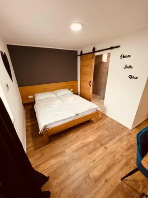 a bedroom with a bed in a room at PJagodic Hotel Cerklje - 5min to Airport - Free Parking in Cerklje na Gorenjskem