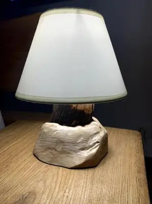 a lamp sitting on top of a wooden table at Zerko Holiday Home - Vineyard Chalet With Sauna and Jacuzzi FREE in Mirna