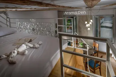 a bedroom with a bed with a teddy bear on it at KariNatura in Ljubljana