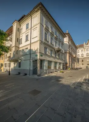 a large building in the middle of a street at KariNatura in Ljubljana