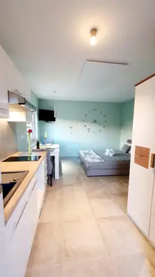 a kitchen with a bed in a room at Villa Ines in Zgornje Škofije