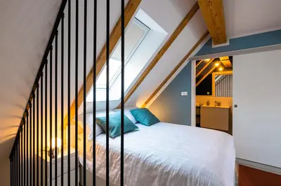 a bedroom with a bed with a window at New Central Studios with parking in Ljubljana
