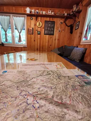 a large map on a table in a room at Koča Kresnica in Ilirska Bistrica