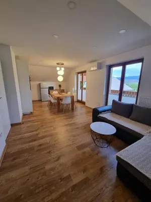 a living room with a couch and a table at Apartment 199 in Zgornje Gorje