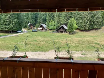 a view from the balcony of a house with a yard at Hut Vaznik in Mrzli Studenec