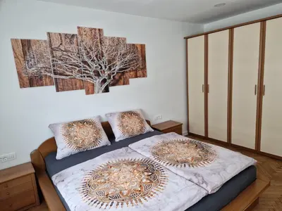 a bedroom with a bed with two pillows on it at Apartmaji PR' KERIN in Laško