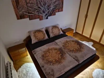 a bedroom with a bed with two pillows on it at Apartmaji PR' KERIN in Laško