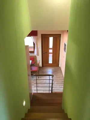 a view of a stairway with a green wall at Charming countryside house in Lome