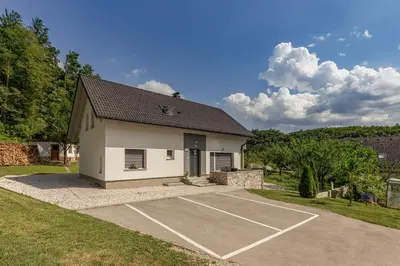 a building with a basketball court in front of it at Apartments Fine Stay Slovenia in Žirovnica