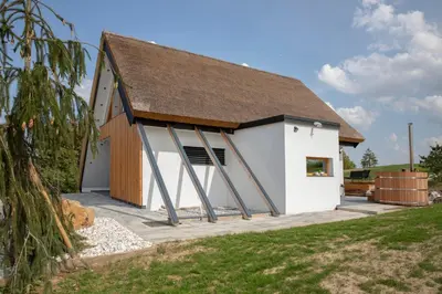 a large white building with a brown roof at Hiska B&N Podlehnik in Podlehnik