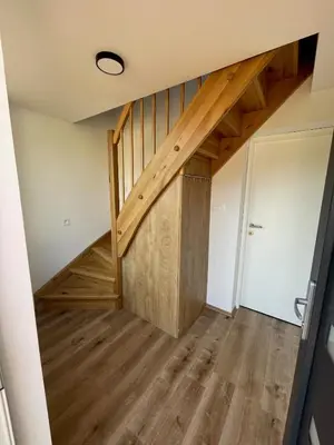 a staircase in a house with wooden floors at Azimut Hiša in Tolmin