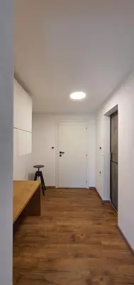 an empty room with white walls and wooden floors at Weekend House Solis - Bovec in Bovec