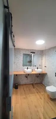 a bathroom with two sinks and a toilet at Weekend House Solis - Bovec in Bovec