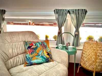 a living room with a couch and a table at Galleria apartment Ljubljana in Ljubljana