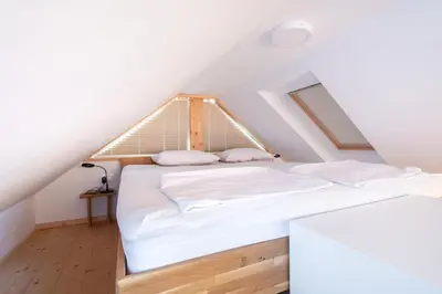 a bedroom with two beds in a attic at Lavender Lodge Bled in Bled