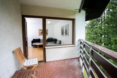 a balcony with a view of a living room at Apartment Vera Kranjska Gora in Kranjska Gora