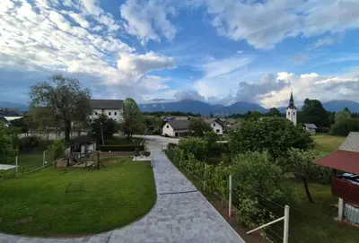 a view of a small town with a church at Annie's apartment in Bled