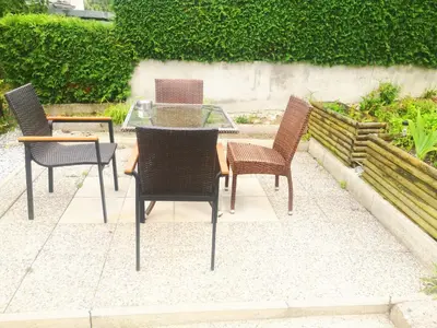 a group of chairs and a table and a table and chairs at Small house in Celje in Celje