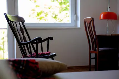 two chairs in a room with a table and a window at Elegant House in a Beautiful Village in Cerklje ob Krki