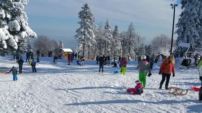 a group of people playing in the snow at Mari 14 in Maribor