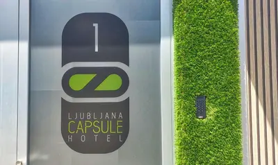 a sign on the side of a door at Ljubljana Capsule Hostel in Ljubljana