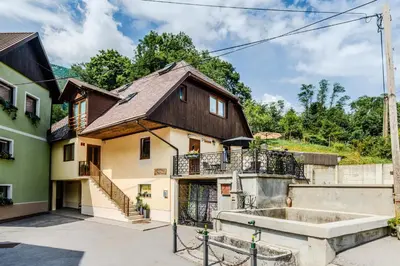 a house with a staircase in front of it at Apartmaji Mouse in Bovec