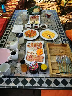 a table with many plates of food on it at Krasberry Ježev brlog in Komen