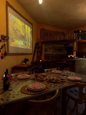 a table with plates of food on it in a kitchen at Krasberry Ježev brlog in Komen