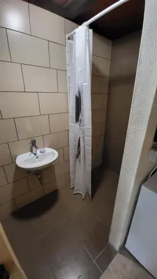 a bathroom with a sink and a shower at Glamping Fikfak in Bled