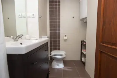 a bathroom with a sink and a toilet at Apartma Mlekuž in Bovec