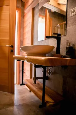 a bathroom with a sink and a mirror at Apartma Mlekuž in Bovec
