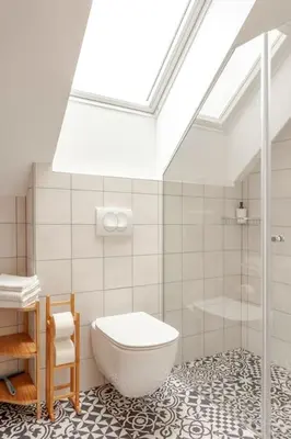 a bathroom with a toilet and a glass shower at Corner House Apartments near Lake Bled in Radovljica