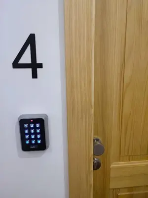 a alarm clock on a wall next to a door at Corner House Apartments near Lake Bled in Radovljica