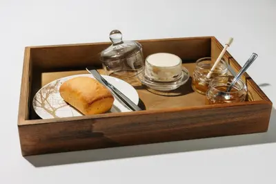a wooden box with a sandwich and a plate in it at The Hotel Ljubljana in Ljubljana