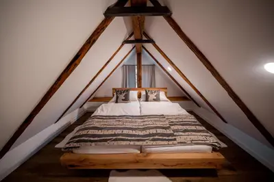 a bedroom with a bed in a attic at House Leska in Kranjska Gora