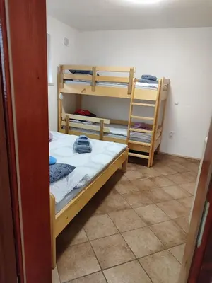 a bedroom with two bunk beds in a room at Apartma Lara in Bled